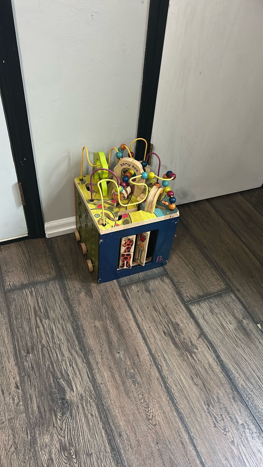 B. toys Zany Zoo Wooden Activity Cube.