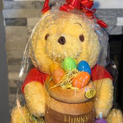 Winnie the Pooh plush with Easter eggs