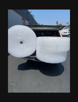 Huge rolls of bubble wrap big and small bubbles and tape