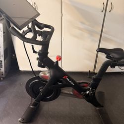 Peloton Exercise Bike with attachment to rotate screen