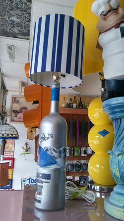 Handmade grey goose lamp.