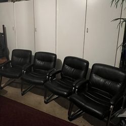 Four Leather Chairs 