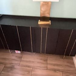 Large black and gold storage cabinet / server