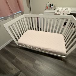 Delta Children Essex 4-in-1 Convertible Baby Crib, Bianca White with Natural Legs