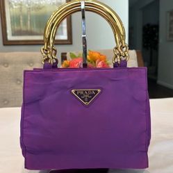 Nylon bag with stylish gold metal straps