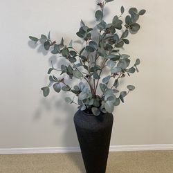 Vase with plants . 