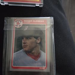 Two cards Larry Fitzgerald and Roger Clemens
