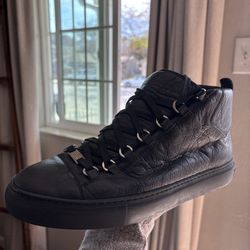 Balenciaga Arena high-top sneakers, crafted from black wrinkled lambskin leather with signature silver-tone D-ring eyelets