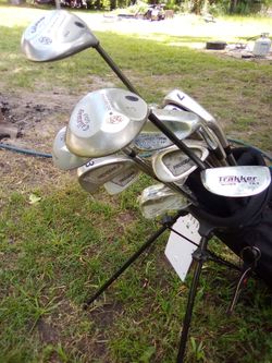2 sets of golf clubs an bags