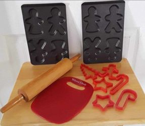 cookie baking lot w/rolling pin, cutting board, cookie cutters and gingerbread men cookie pans $10 FIRM