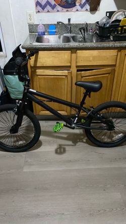 Matte Black BMX Bike with Green Pedals