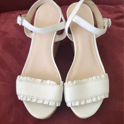 Kate Spade New York Tomas white leather ruffle wedge cork platform sandals. 