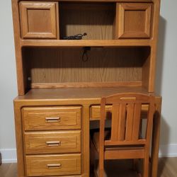 Desk, Hutch And Chair In Great Shape. Desk 44" wide x 18" deep x 30" tall.  Hutch that sits on top of desk 44" wide x 12" deep x 30" tall 