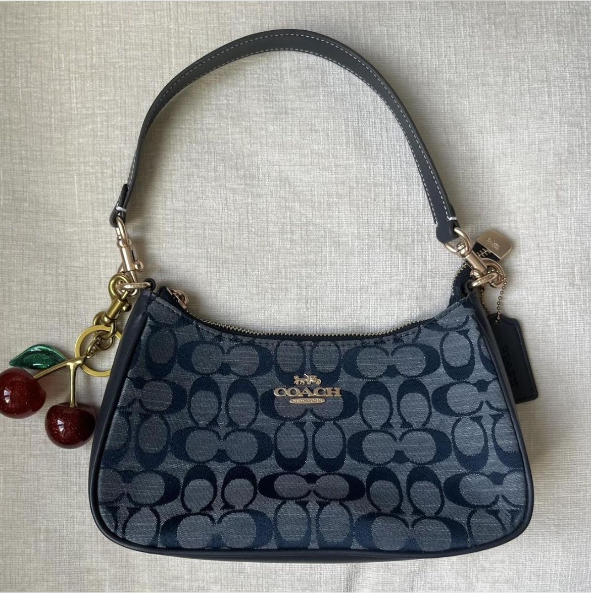 Coach Teri Shoulder in Signature Denim with cherry charm (not from coach)