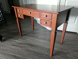 Desk - solid hardwood - Great Condition. This is a beautiful piece that will last.