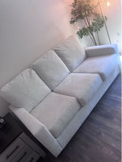 Ashley Furniture -  White Sleeper Sofa (Full size mattress included)