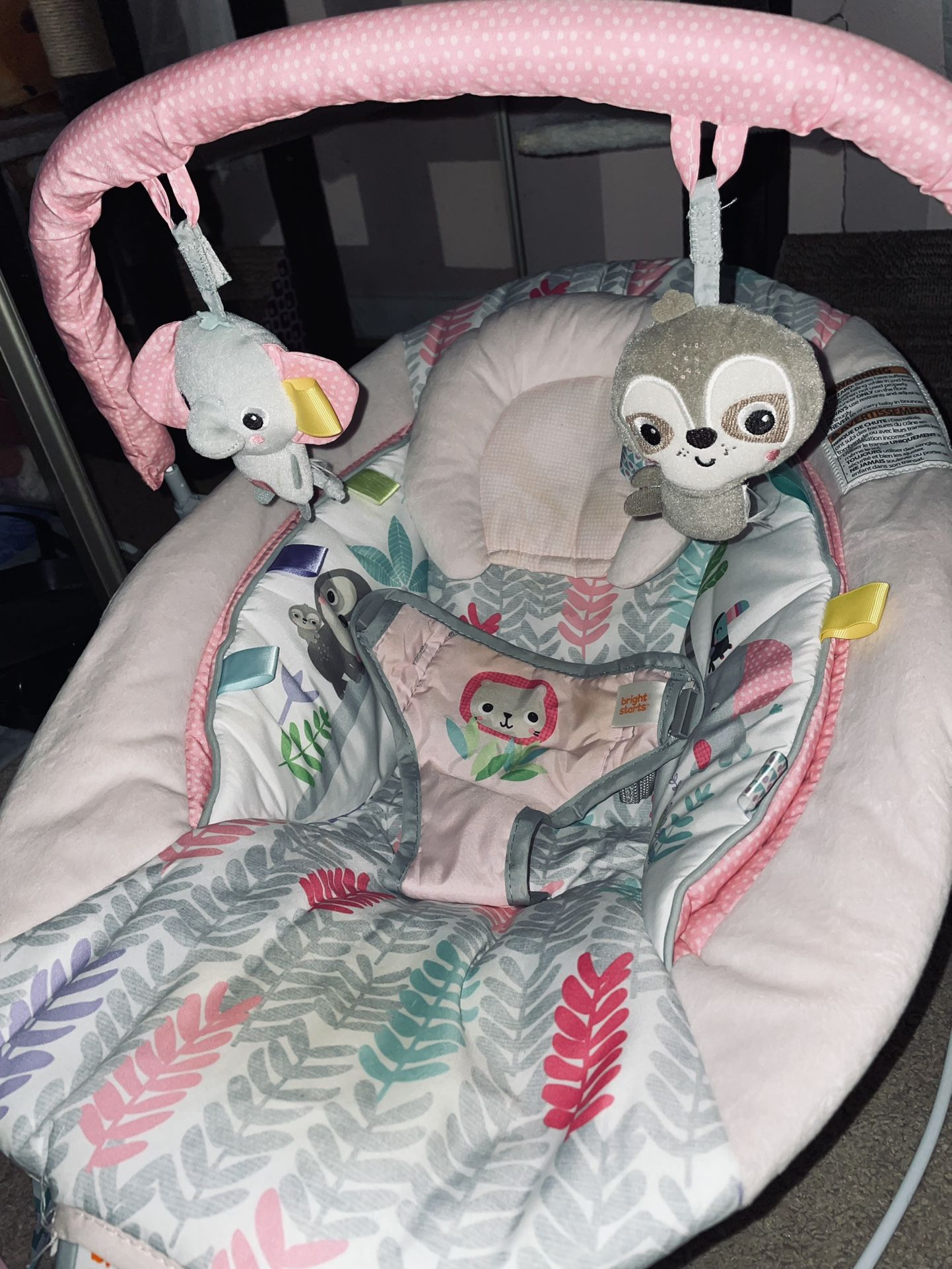 Baby bouncer with soothing vibrations and music.