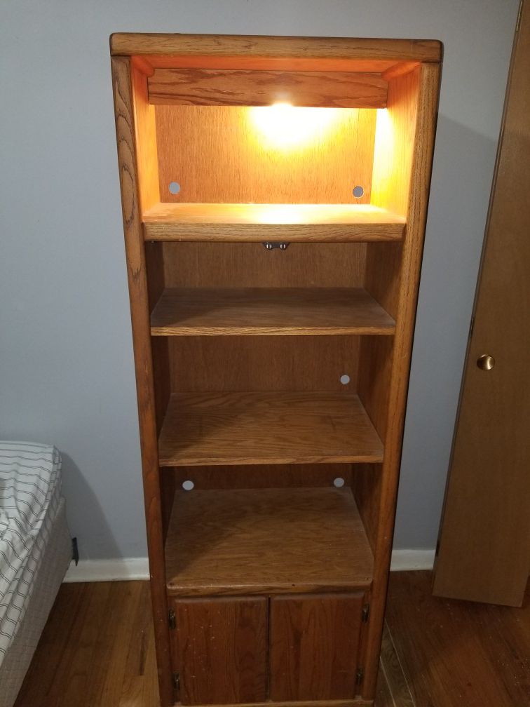 4 shelf wooden bookcase with light and bottom cabinet