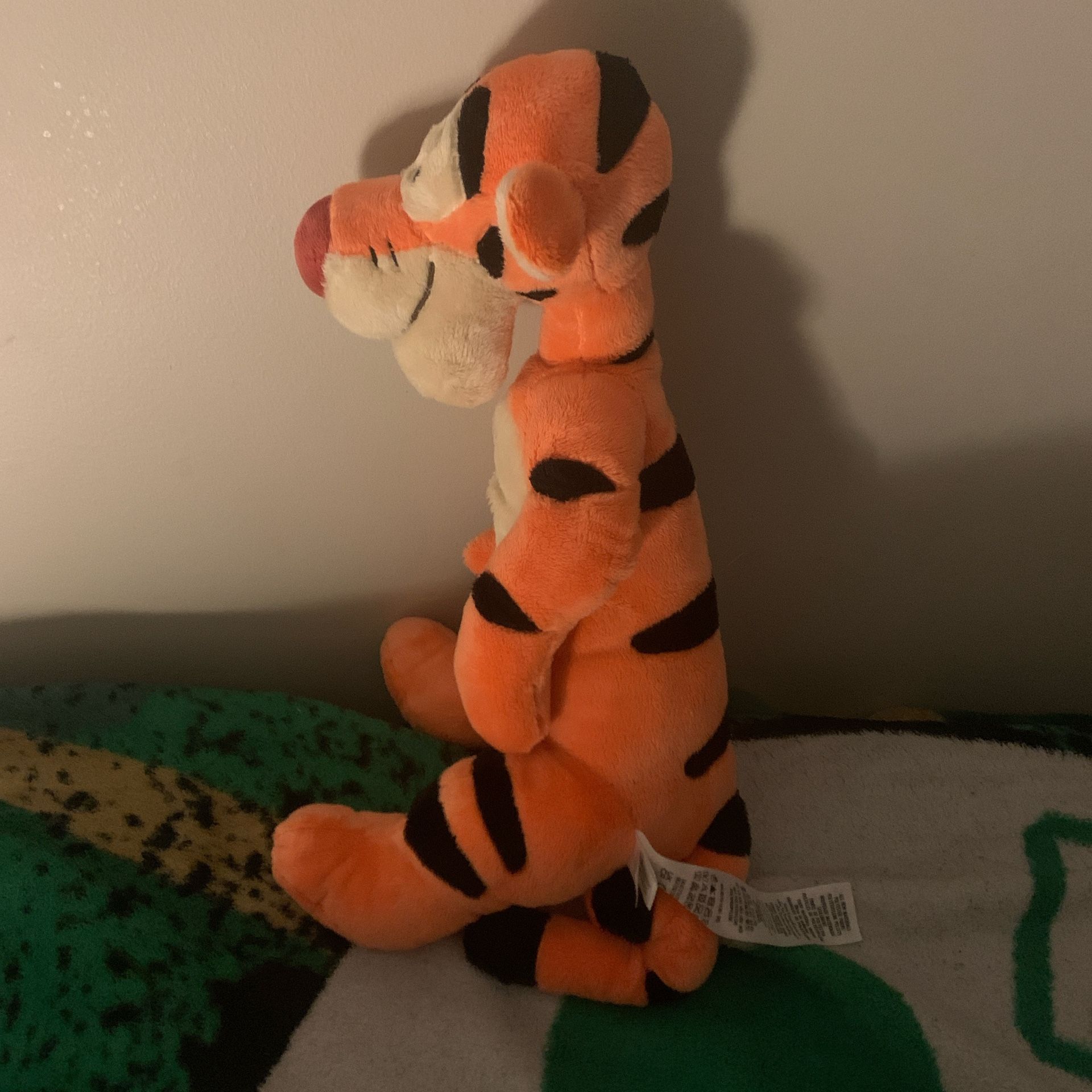 One orange Disney tiger plush toy.