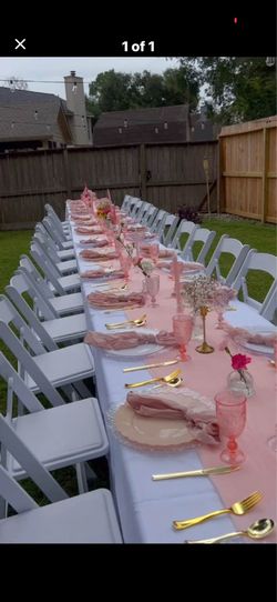 White resin garden chairs and tables