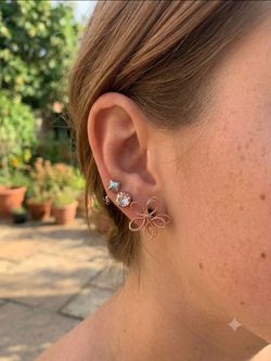 Three Pairs Of Earrings Gold-tone wire flower, Geometric studs & crystal accents