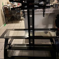 T.V Stand Holds Up To A 50” T.V  In Great Shape