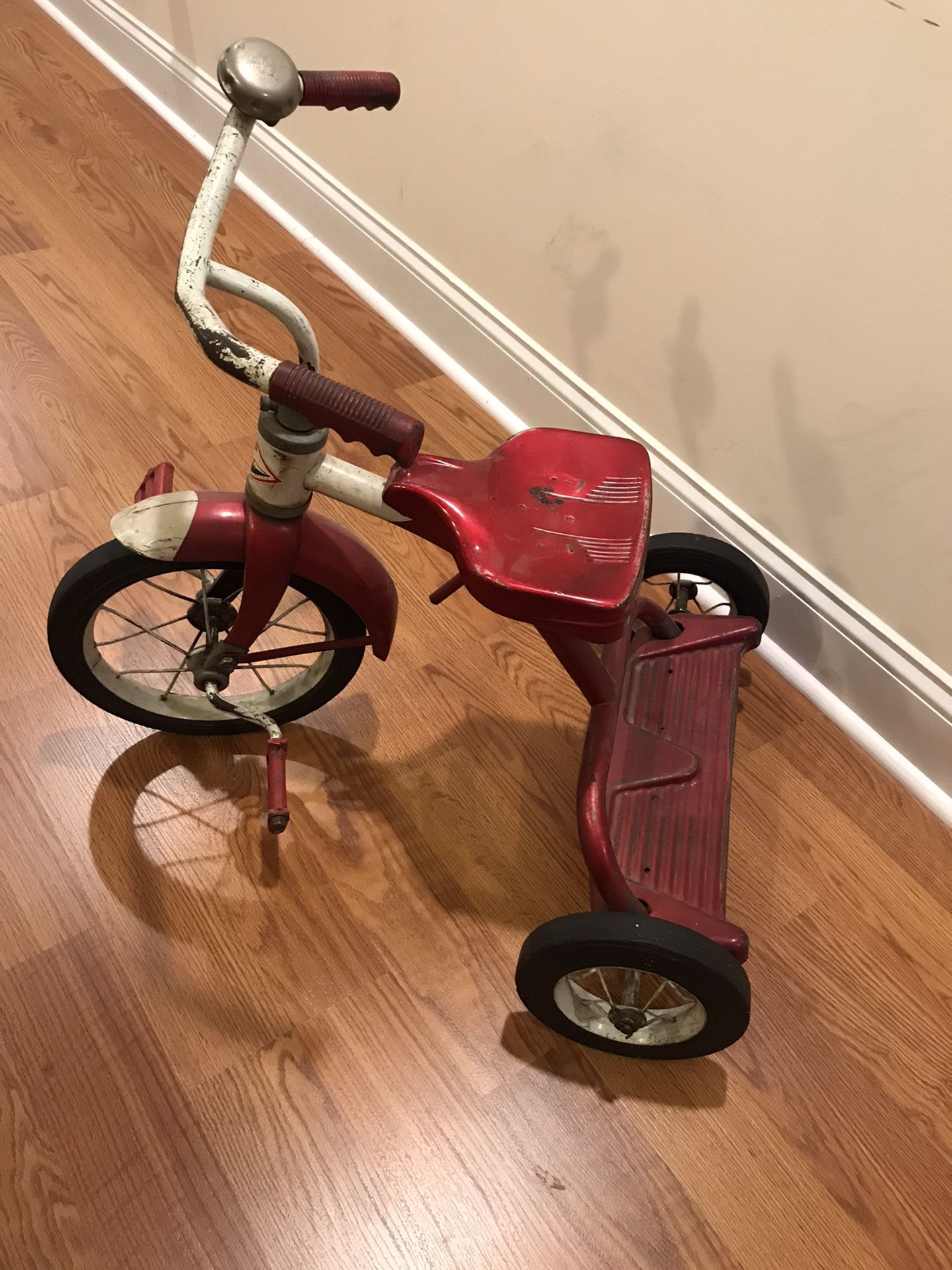 Vintage red child’s riding Junior toy division AMF tricycle