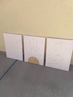 set of three 12” × 16” sunburst canvas prints