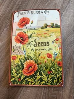 Seeds metal wall plaque 11x8”