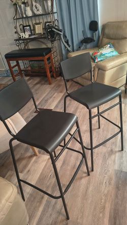 2 tall metal chairs
