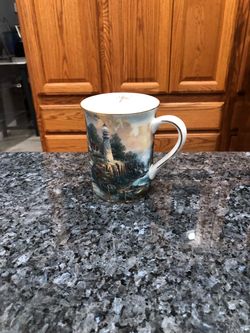 Thomas Kinkade 2002 Joy of the Season April Coffee mug.  “The Light of Peace”.  Size 4 inches tall.  Brand new never used.  Has been on display in a c