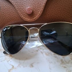 RAY BAN AVIATORS w/ BLUE.TINTED LENSES AND A POLISHED SILVER FRAME. BRAND NEW $100  OR BEST OFFER
