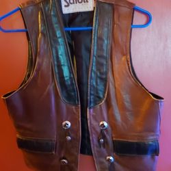 For Sale Brown and Black leather vest pretty neat   Size  Medium   $100  OBO
