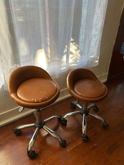 Pair of Brown Leather Rolling Stools
