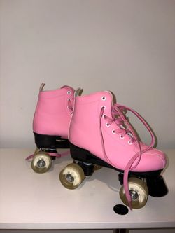 Pink four-wheeled skates