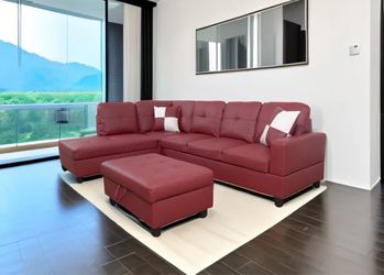 Red leather sectional couch and ottoman