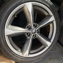 Four slightly used rims and tires