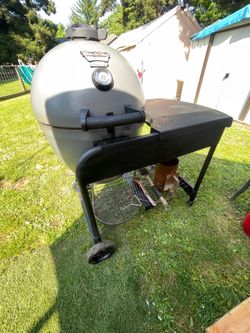 Durable Char-Griller Akorn Kamado Kooker grill. This egg-shaped charcoal grill is great for smoking and grilling. It has a built-in thermometer, side 