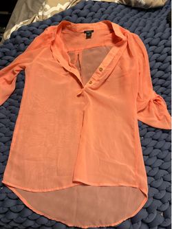 Sheer coral and plum blouses with a relaxed, flowy silhouette.