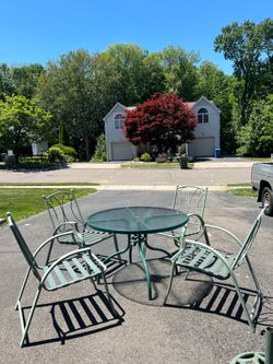 Patio set table for chairs, umbrella, and umbrella stand