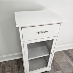 Great condition, barely used, White cabinet. Wood and glass.