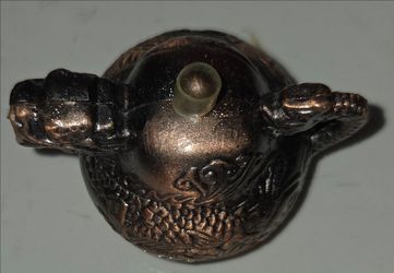 Miniature decorative dragon teapot figurine, 3" diameter, 2.5" height. Raised embossed dragon carvings all over body, dragon‑head spout and handle. Br