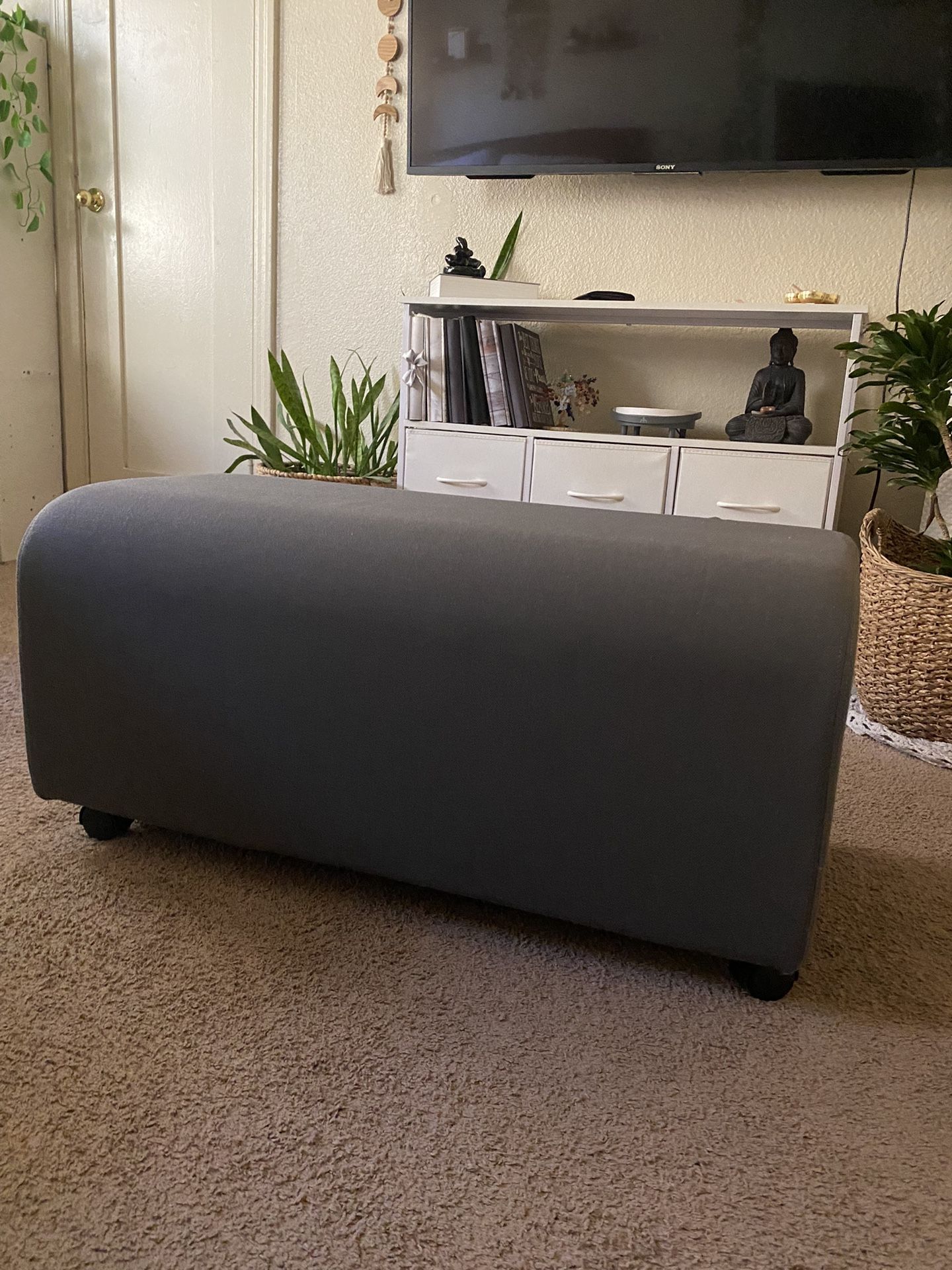 gray ottoman 