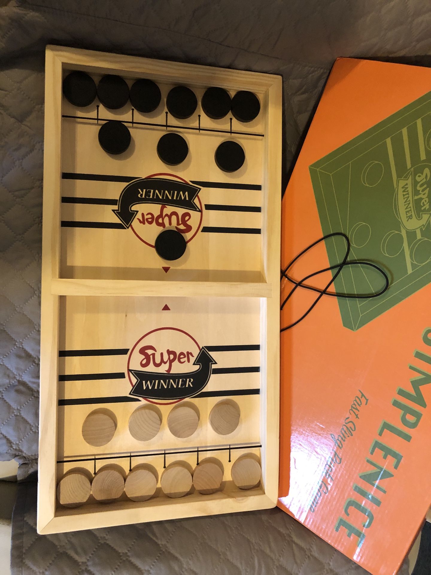 New in box wooden simplenice fast sling puck game