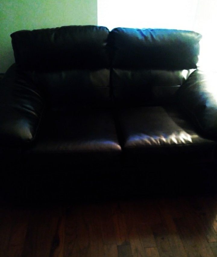 Black genuine leather 2seat sofa gently used