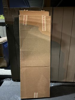 Sturdy, tall, flat cardboard box, about 5.5 feet x 2 feet x 6 inches.
