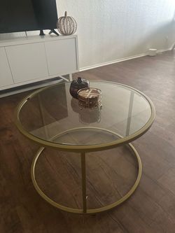 Round clear glass w/ gold coffee table