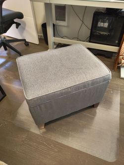 Gray storage ottoman