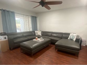Sectional 4 pcs + storage ottoman.  $1800 OBO Color: granite (dark gray).