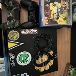 PS4 W/ 2 Controllers AND 7 Games 